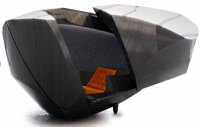 Studio view of the STRAUSS ELEKTROAKUSTIK OPC (Original Presentation Capsule) at SE MUSICLAB in Bern, Switzerland, showcasing the futuristic, carbon-textured physical acoustic shell structure enclosing an optimized listening space and integrated orange leather studio chair set against a clean white background.