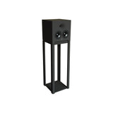 Front three-quarter perspective view of a single STRAUSS ELEKTROAKUSTIK SE AP-1 Active-Passive Reference Monitor mounted on a custom floor stand, set against a clean white background, showcasing the vertical driver alignment, custom high-frequency compression driver horn, and minimal mechanical system engineering.
