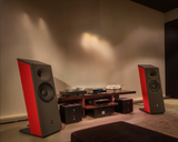 A stereo pair of STRAUSS ELEKTROAKUSTIK SE MF-4S Large-Format Floorstanding Passive Monitoring System with custom red side panels, integrated into a high-end residential hi-fi environment featuring premium source components, a turntable setup, and two matching SE PA-250 power amplifiers running in a dual-mono configuration.