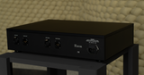 Rear three-quarter perspective view of the STRAUSS ELEKTROAKUSTIK SE REQ-1S Reference Monitoring and Room Equalizer resting on a studio stand, highlighting the balanced XLR inputs and outputs for independent dual-mono calibration, integrated power block, and heavy-duty mechanical chassis design set against a textured acoustic background.